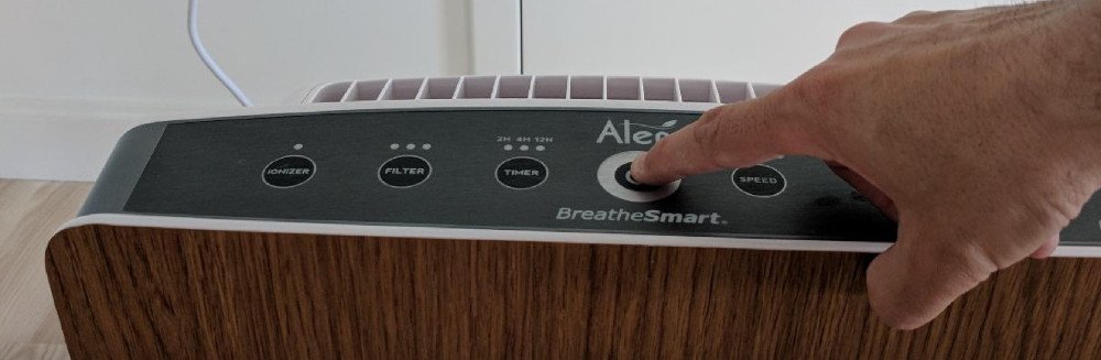 Touching the buttons on an Air Purifier